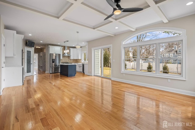 unfurnished living room with a ceiling fan, coffered ceiling, light wood-style flooring, baseboards, and recessed lighting