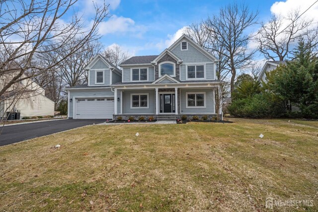 118 Cambridge Rd, Westfield, NJ 07090 - view of front facade featuring driveway, covered porch, a garage, and a front yard