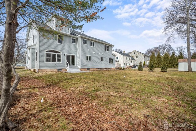 118 Cambridge Rd, Westfield, NJ 07090 - back of house featuring entry steps, a lawn, and a shed