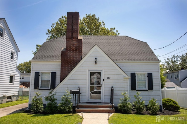 719 Charles St, South Amboy, NJ 08879 - view of front facade with a chimney