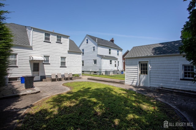 719 Charles St, South Amboy, NJ 08879 - view of grassy yard with a patio