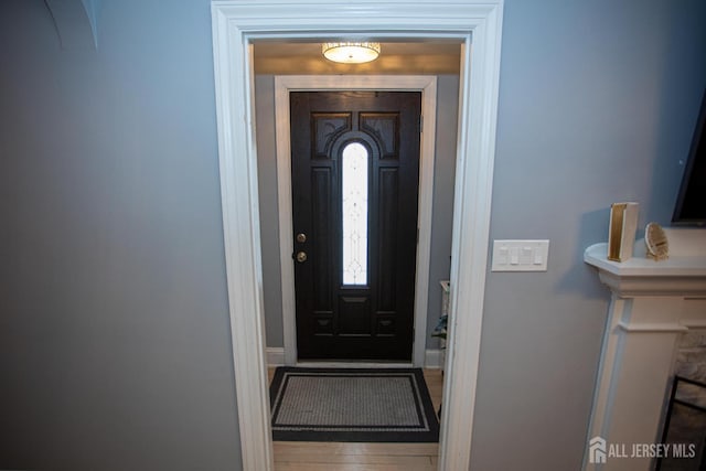 719 Charles St, South Amboy, NJ 08879 - foyer with baseboards and wood finished floors