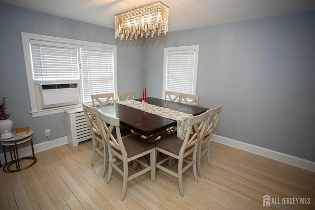 719 Charles St, South Amboy, NJ 08879 - dining space featuring a chandelier, light wood finished floors, healthy amount of natural light, and cooling unit