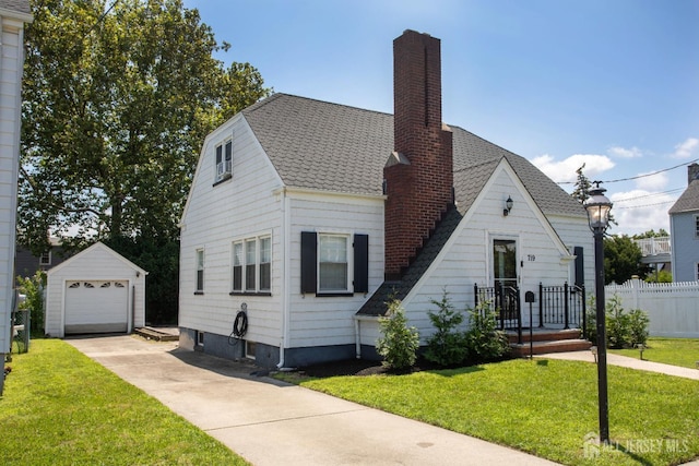 719 Charles St, South Amboy, NJ 08879 - view of front of property featuring a chimney, an outdoor structure, driveway, a garage, and roof with shingles