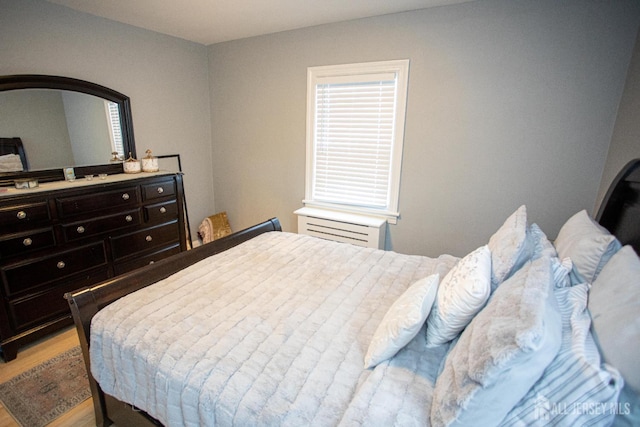 719 Charles St, South Amboy, NJ 08879 - bedroom featuring light wood finished floors and arched walkways