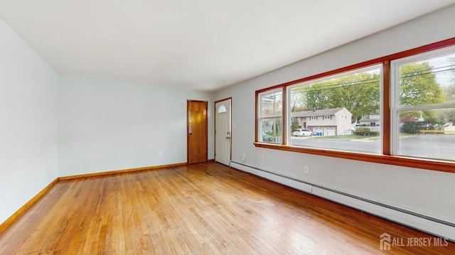 190 S Moetz Dr S, Milltown, NJ 08850 - empty room with a baseboard radiator, hardwood / wood-style floors, and baseboards