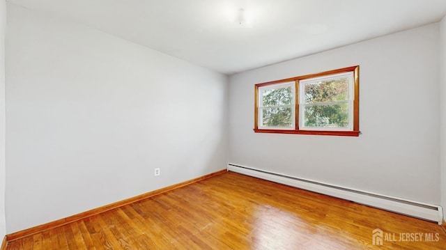 190 S Moetz Dr S, Milltown, NJ 08850 - spare room featuring a baseboard radiator, baseboards, and light wood finished floors