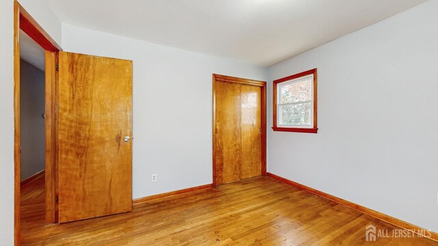 190 S Moetz Dr S, Milltown, NJ 08850 - unfurnished bedroom featuring wood finished floors, baseboards, and a closet
