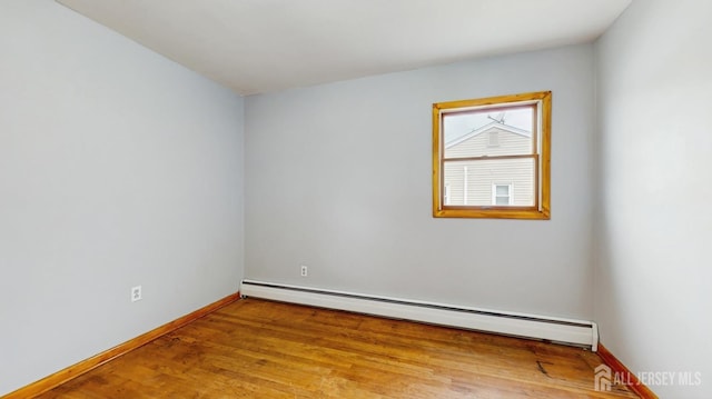 190 S Moetz Dr S, Milltown, NJ 08850 - unfurnished room featuring a baseboard radiator, baseboards, and wood finished floors