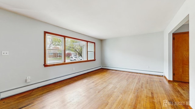 190 S Moetz Dr S, Milltown, NJ 08850 - unfurnished room featuring hardwood / wood-style floors, a baseboard radiator, and baseboards