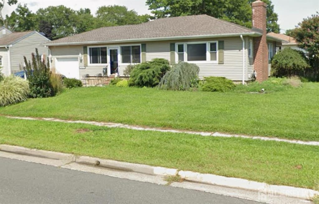 2907 Norwood Ave, South Plainfield, NJ 07080 - single story home with a chimney, an attached garage, and a front lawn