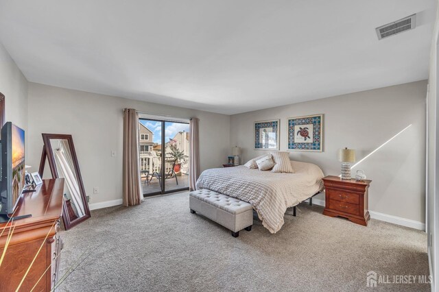 bedroom with baseboards, visible vents, access to outside, and carpet floors