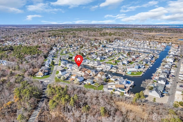 aerial view with a residential view and a water view