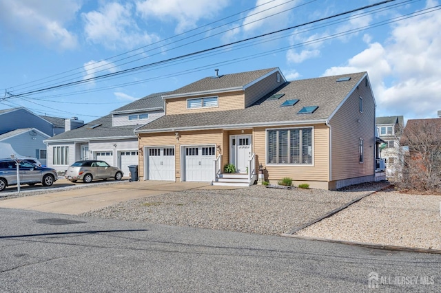 view of front of home featuring driveway, an attached garage, and roof with shingles