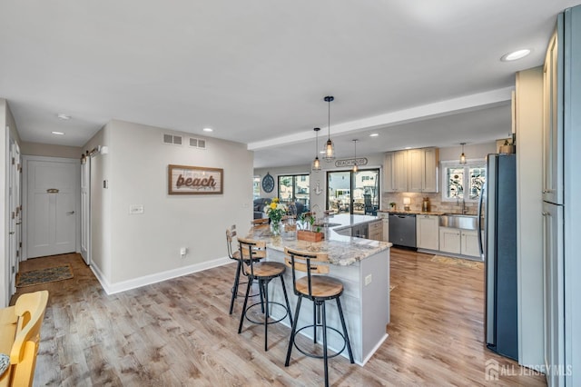 kitchen with appliances with stainless steel finishes, recessed lighting, and baseboards