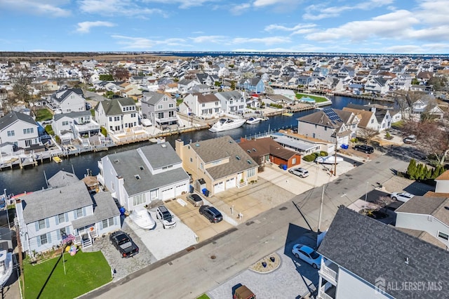 aerial view featuring a water view and a residential view