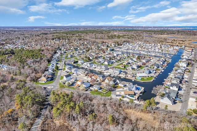 bird's eye view with a water view and a residential view