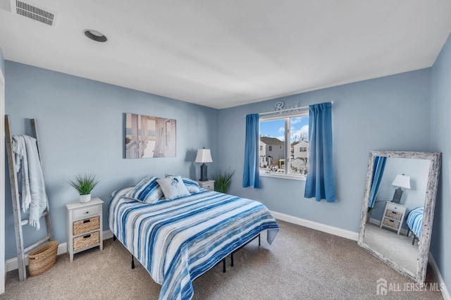 bedroom featuring visible vents, carpet floors, and baseboards