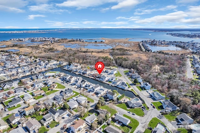 birds eye view of property with a residential view and a water view