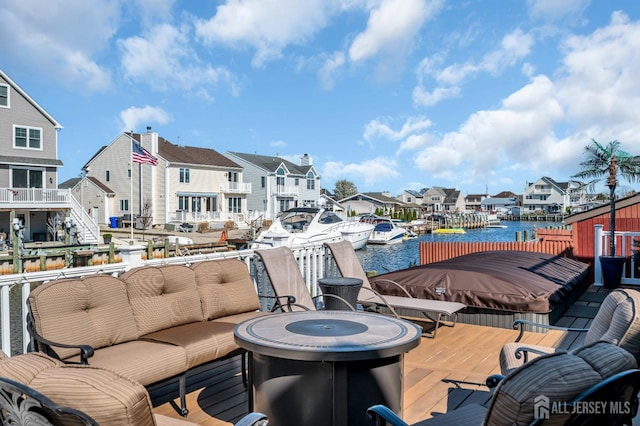 8 Bahia Ct, Brick, NJ 08723 - wooden deck with a residential view, a water view, an outdoor hangout area, and a boat dock
