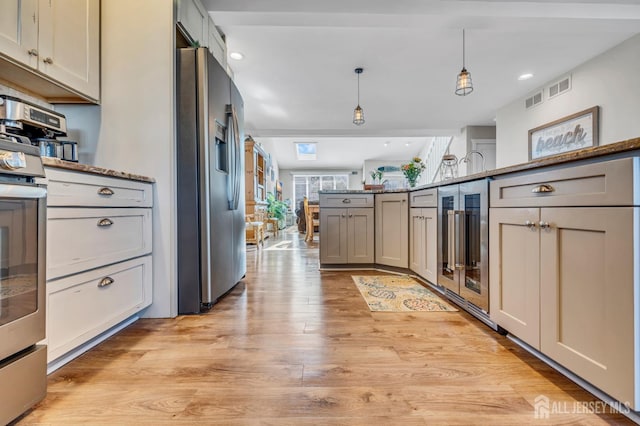8 Bahia Ct, Brick, NJ 08723 - kitchen featuring appliances with stainless steel finishes, beverage cooler, pendant lighting, light wood-style flooring, and gray cabinetry