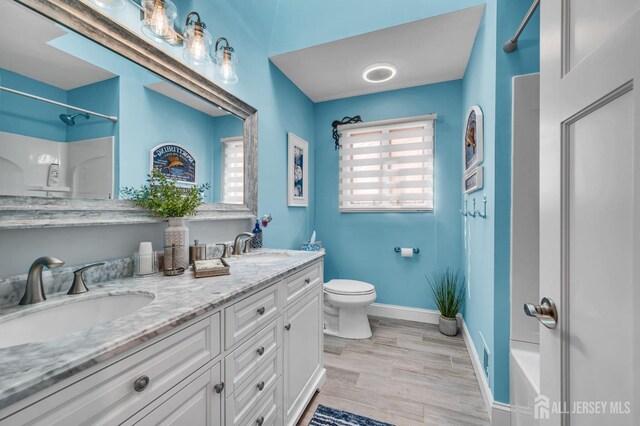 8 Bahia Ct, Brick, NJ 08723 - bathroom with double vanity and wood finished floors