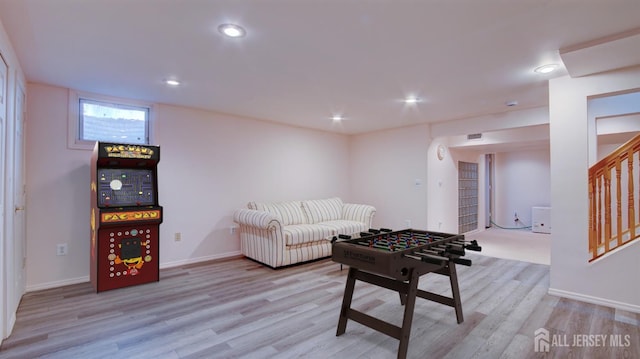 playroom with wood finished floors, baseboards, and recessed lighting
