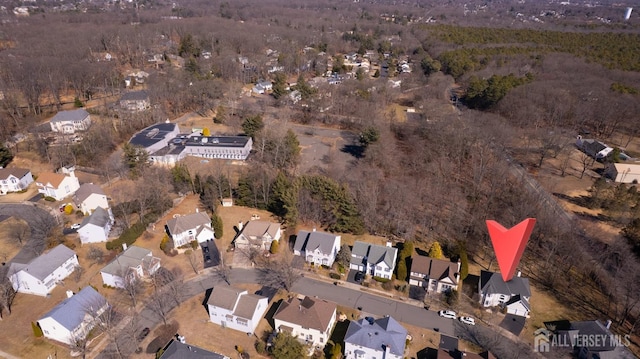 aerial view of property and surrounding area with nearby suburban area