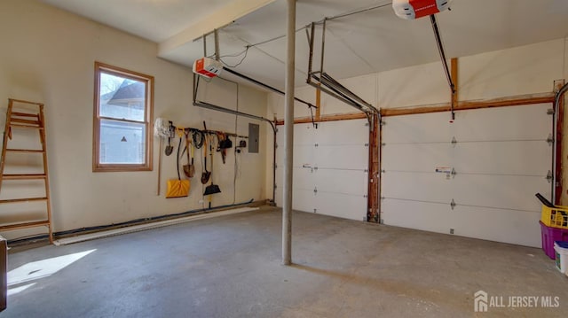 garage featuring electric panel and a garage door opener