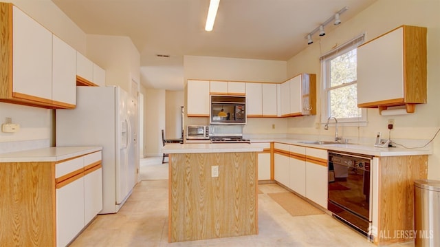 kitchen featuring black appliances, a sink, a center island, white cabinetry, and light countertops