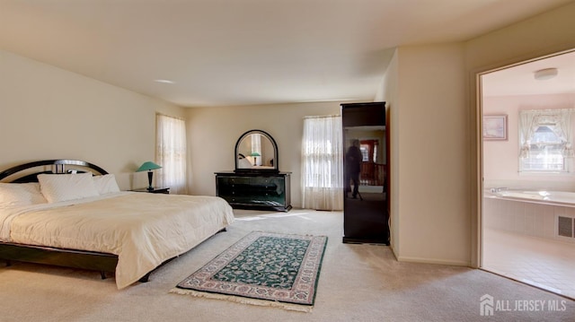 bedroom with carpet floors and multiple windows