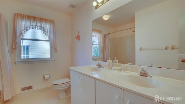 bathroom with plenty of natural light, toilet, tile patterned flooring, and a shower with shower curtain