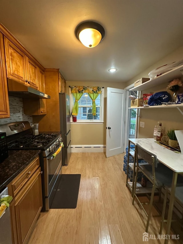 4 Fitzsimmons Ave, Middlesex, NJ 08846 - kitchen with stainless steel appliances, brown cabinets, light wood finished floors, under cabinet range hood, and dark stone counters