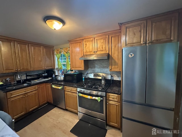 4 Fitzsimmons Ave, Middlesex, NJ 08846 - kitchen featuring stainless steel appliances, under cabinet range hood, brown cabinetry, and backsplash