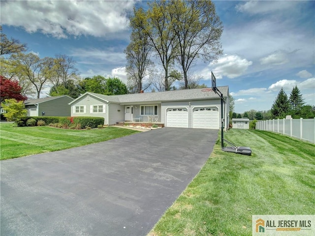 ranch-style home with driveway and a garage