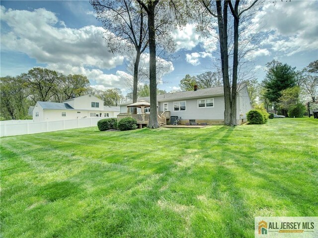 view of yard featuring a deck