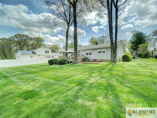 3 Camelot Dr, East Brunswick, NJ 08816 - back of house with a wooden deck and a chimney