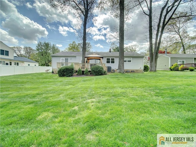 rear view of house featuring a gazebo and a deck