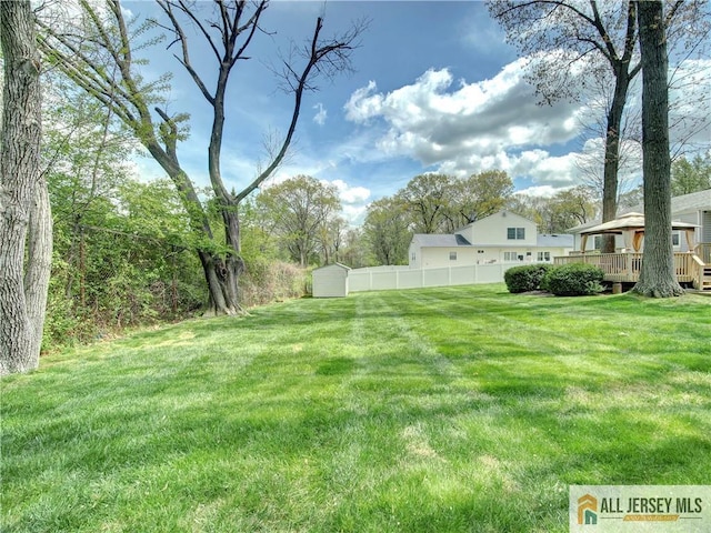 3 Camelot Dr, East Brunswick, NJ 08816 - view of yard featuring a wooden deck