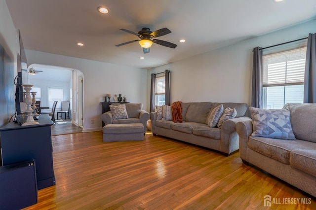 living area with ceiling fan, wood finished floors, recessed lighting, and baseboards