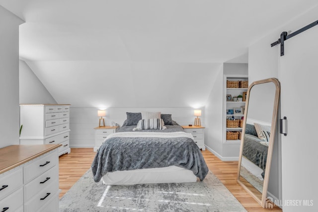 1 Highview Rd, East Brunswick, NJ 08816 - bedroom with light wood finished floors, a barn door, and baseboards