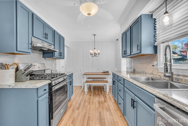 1 Highview Rd, East Brunswick, NJ 08816 - kitchen with stainless steel appliances, under cabinet range hood, blue cabinets, a sink, and tasteful backsplash