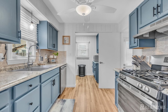1 Highview Rd, East Brunswick, NJ 08816 - kitchen featuring stainless steel appliances, a sink, blue cabinets, under cabinet range hood, and backsplash