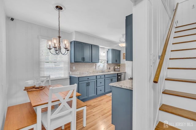 1 Highview Rd, East Brunswick, NJ 08816 - kitchen featuring blue cabinets, a sink, dishwasher, a chandelier, and backsplash