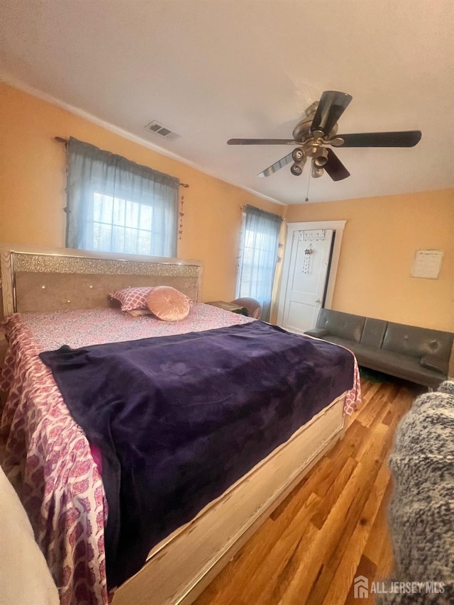 bedroom featuring ceiling fan and light hardwood / wood-style flooring