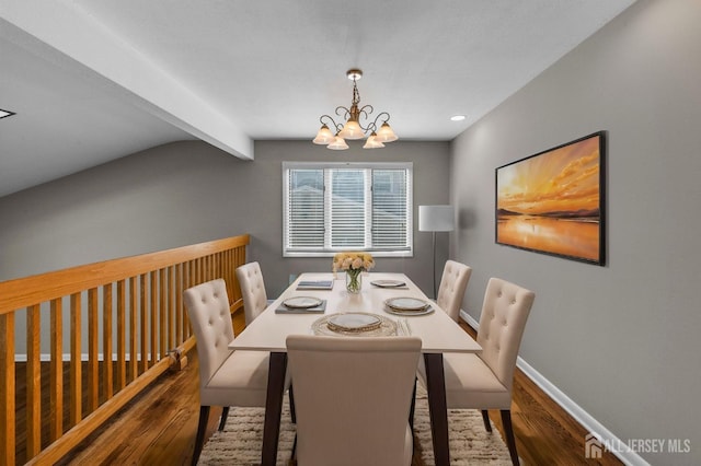 dining room with wood finished floors, beamed ceiling, baseboards, and a chandelier