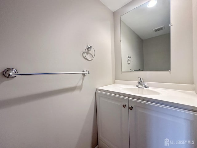 bathroom with visible vents and vanity
