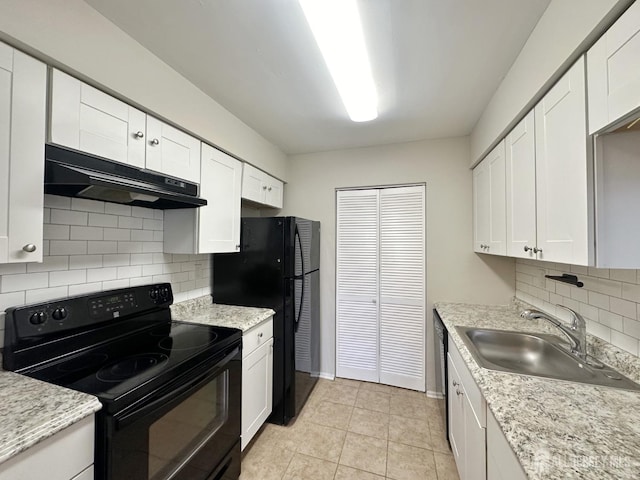 kitchen featuring a sink, white cabinetry, under cabinet range hood, and black appliances