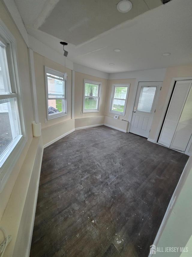 81 Hickory St, Carteret, NJ 07008 - spare room with dark wood-style flooring and recessed lighting