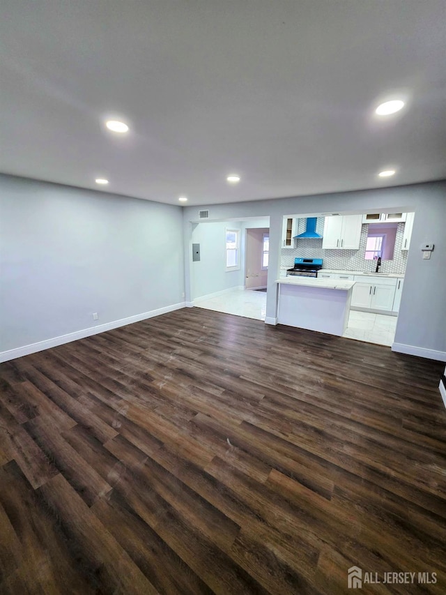 81 Hickory St, Carteret, NJ 07008 - unfurnished living room featuring dark wood-type flooring and recessed lighting